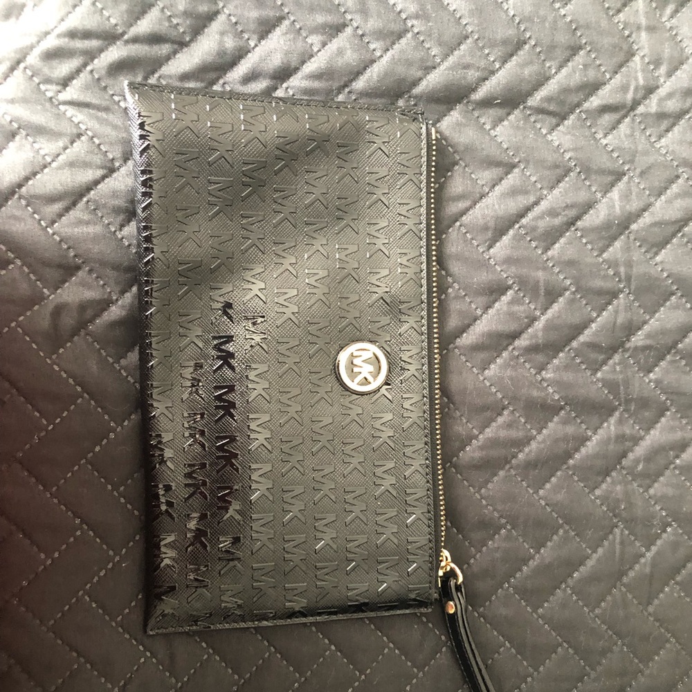 Michael Kors wristlet. Never used, brand new patent leather with embossed MKs.